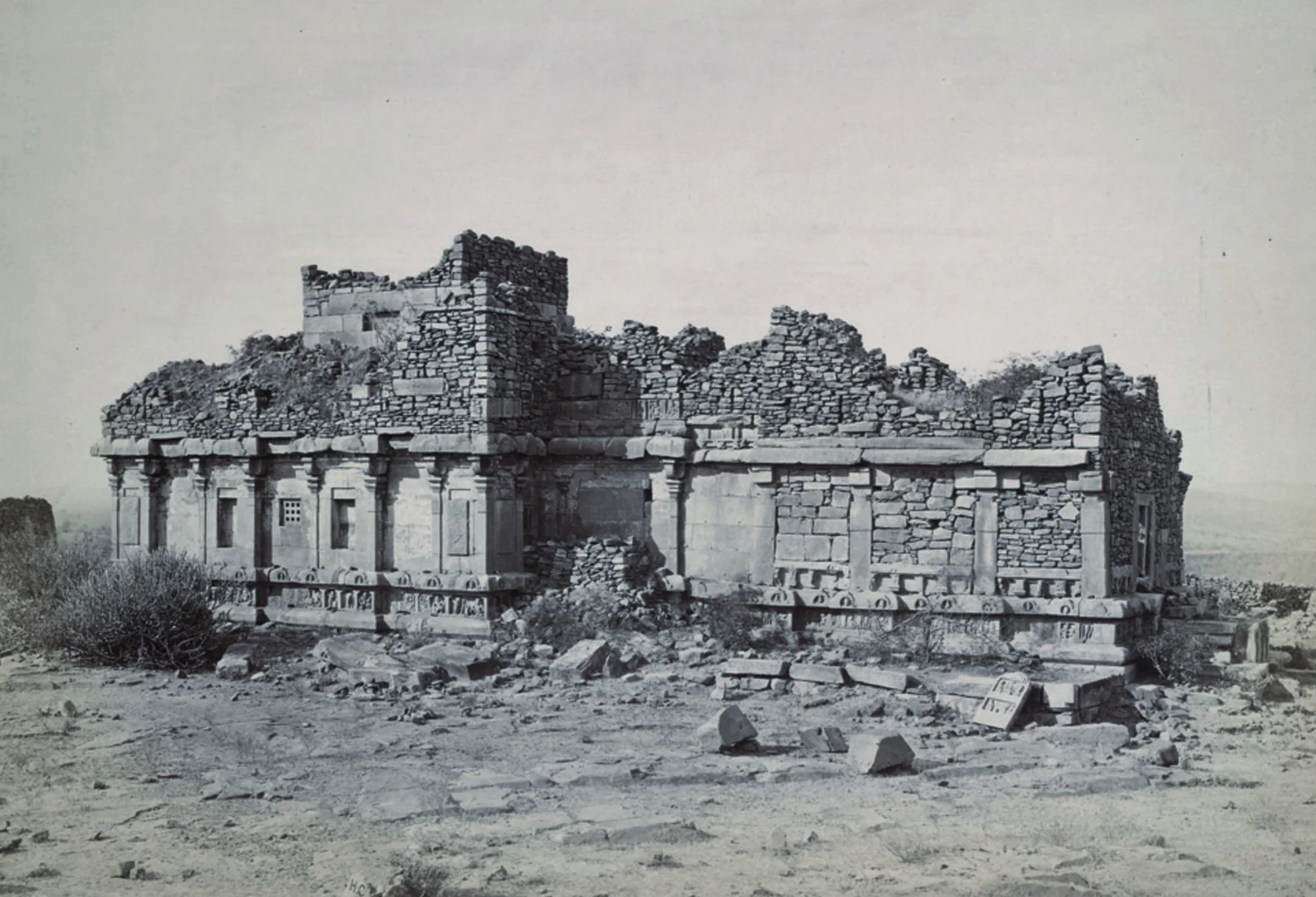 Historical photograph of Meguti Jain temple ruins from the 1880s