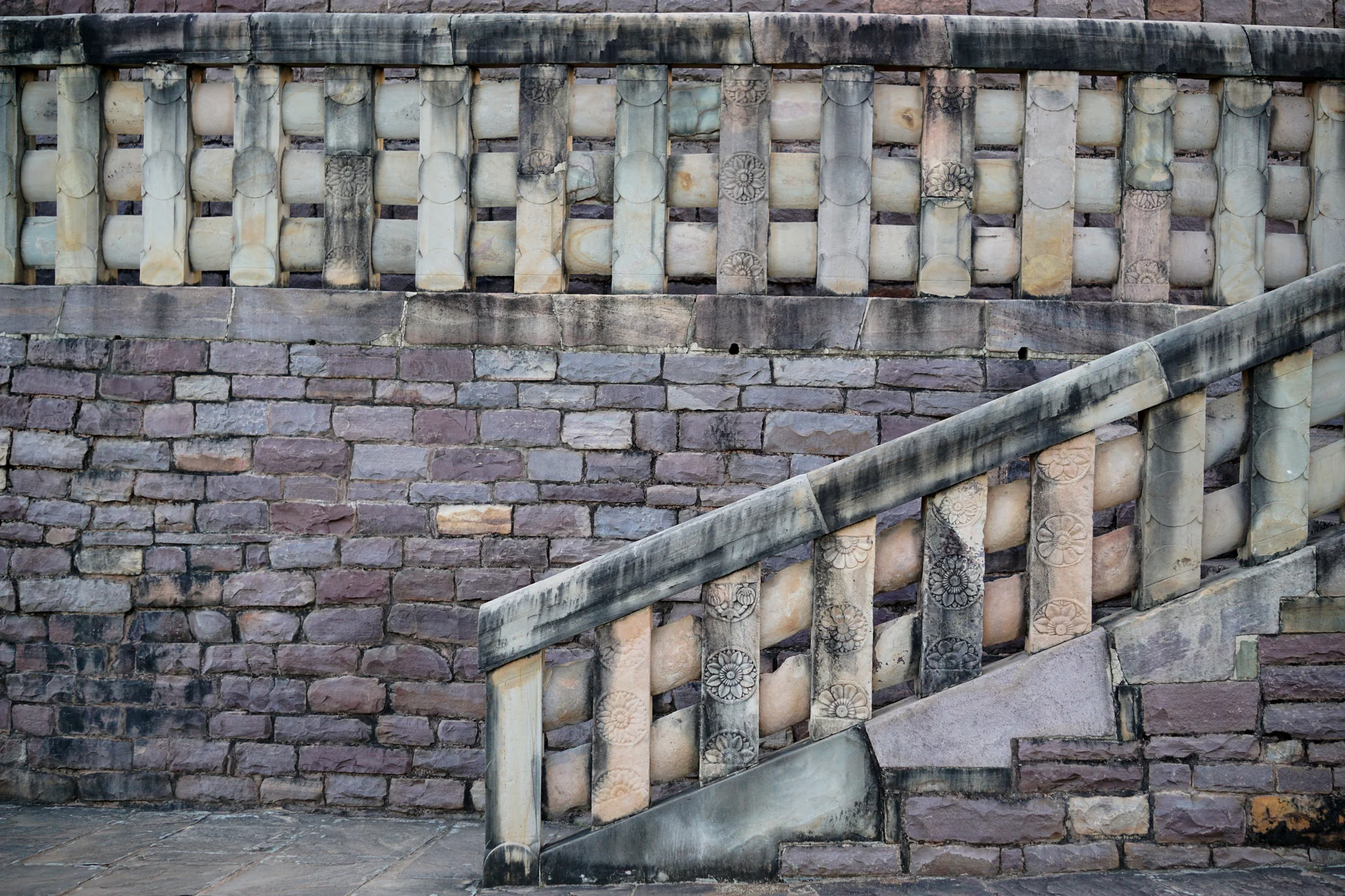 Carved stone railing at stairway