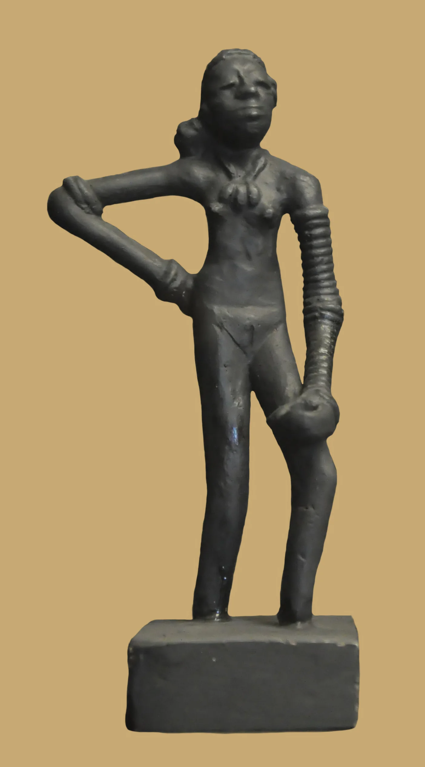 Dancing Girl sculpture against dark background