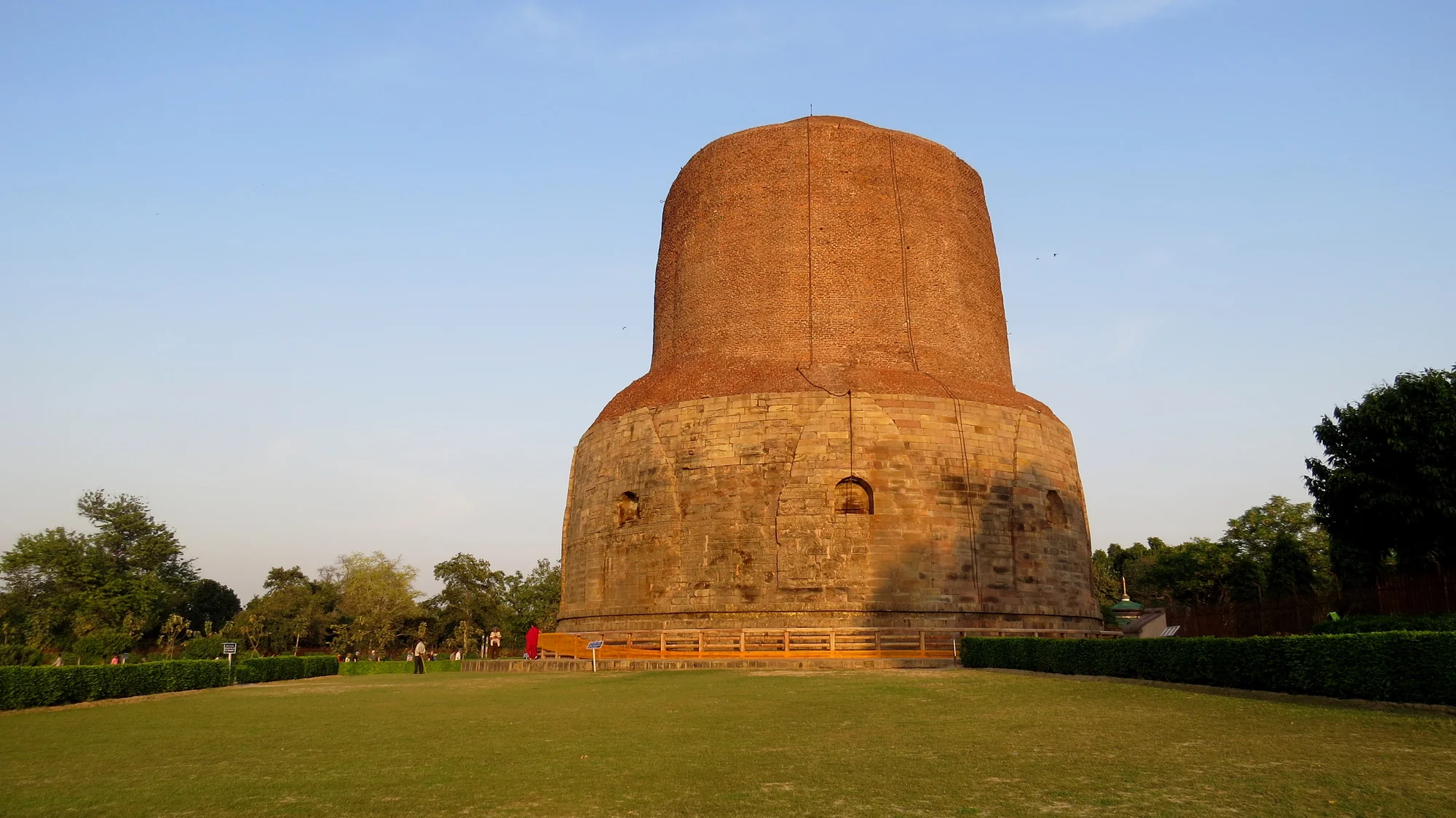 Full view of Dhamek Stupa showing its cylindrical form