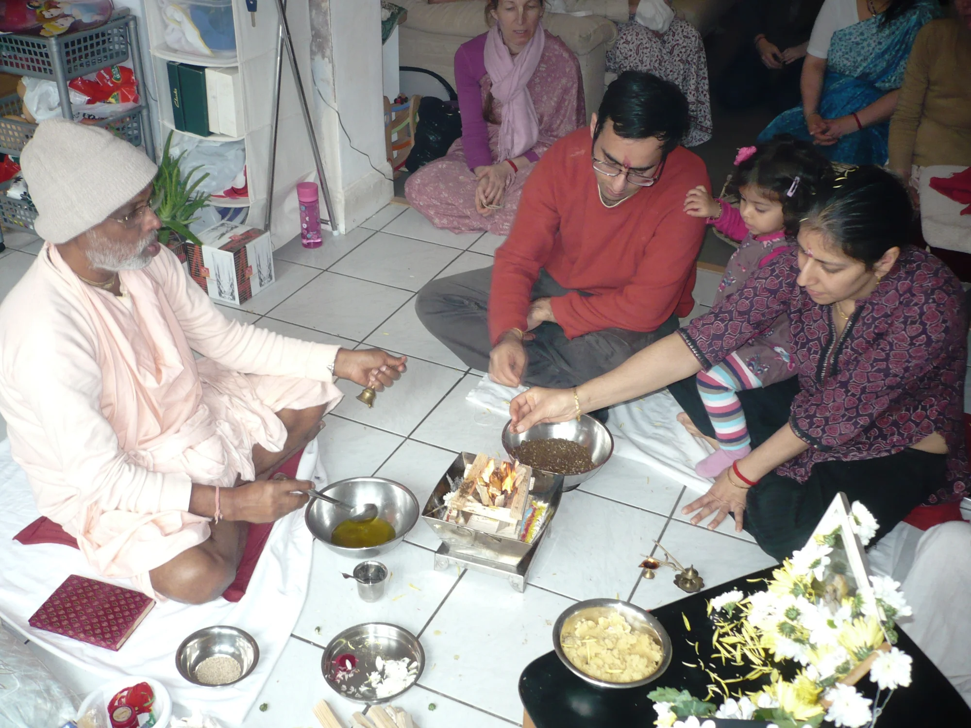 Family performing puja together