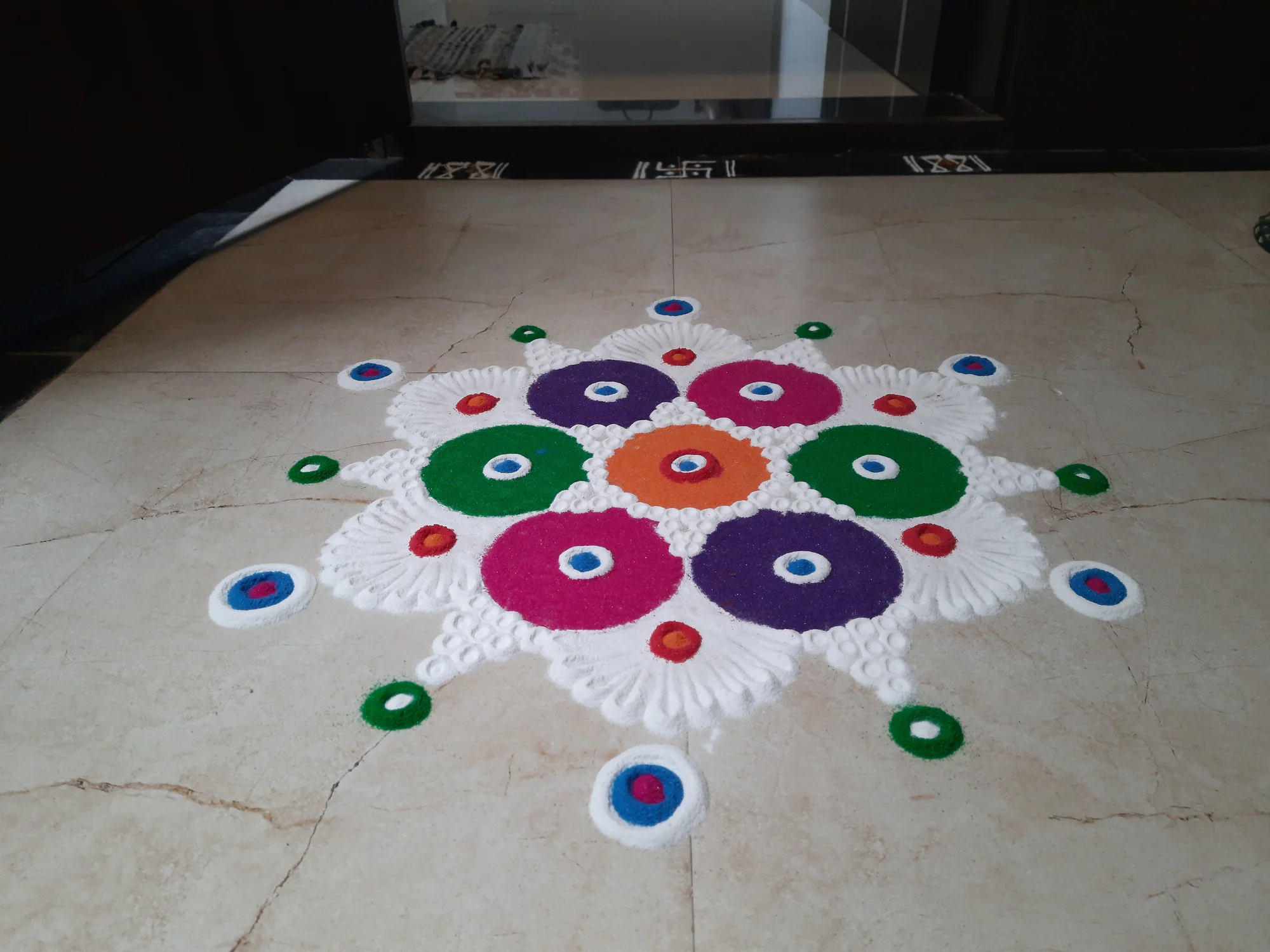 Rangoli at the entrance of a home