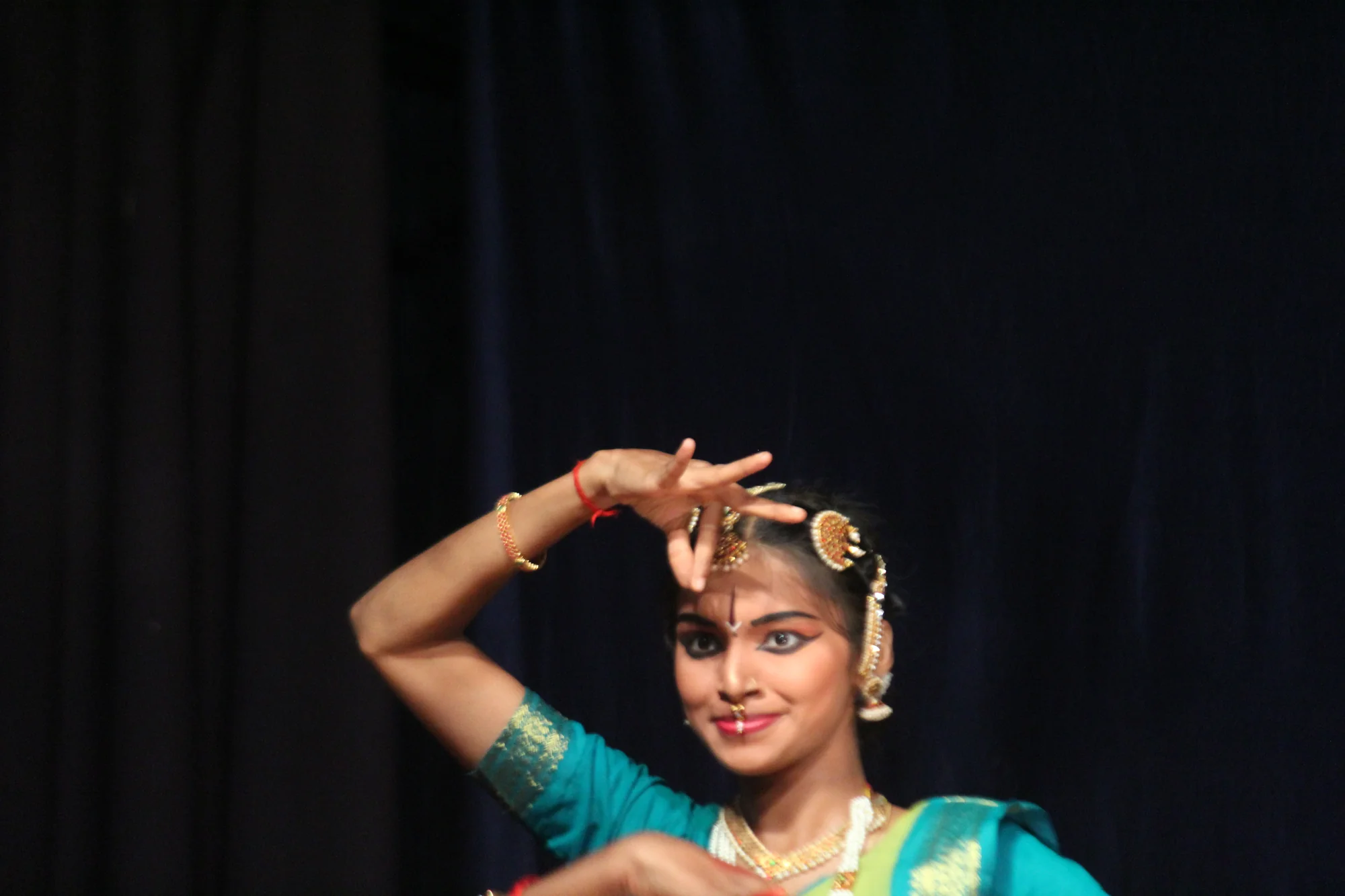 Bharatanatyam dancer in elaborate traditional costume and jewelry