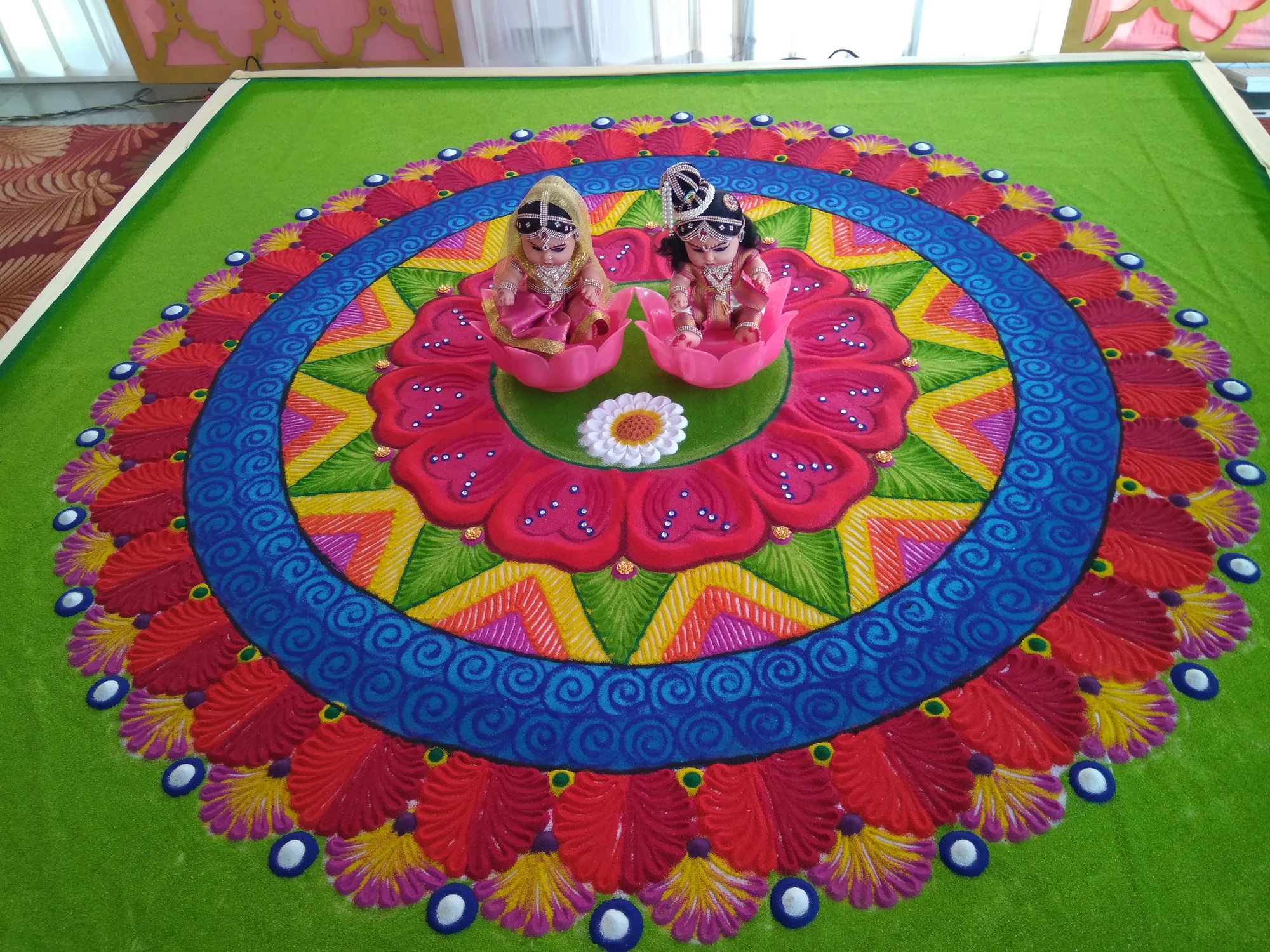 Colorful rangoli with symmetrical patterns and vibrant colors