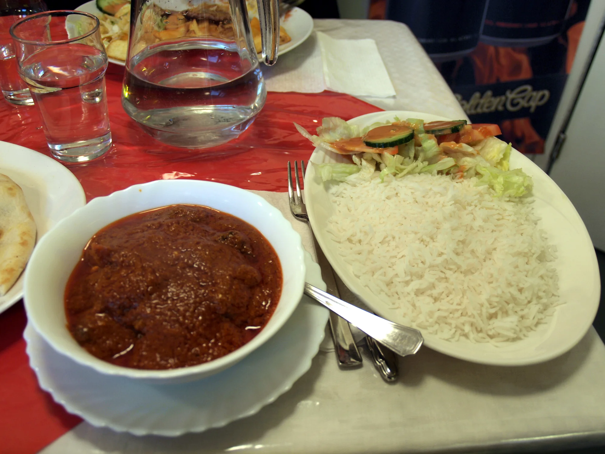 Lamb vindaloo served in a restaurant setting in Helsinki