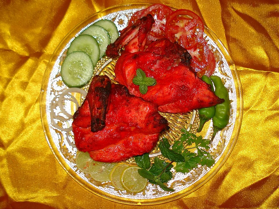 Cooked tandoori chicken pieces on a serving platter