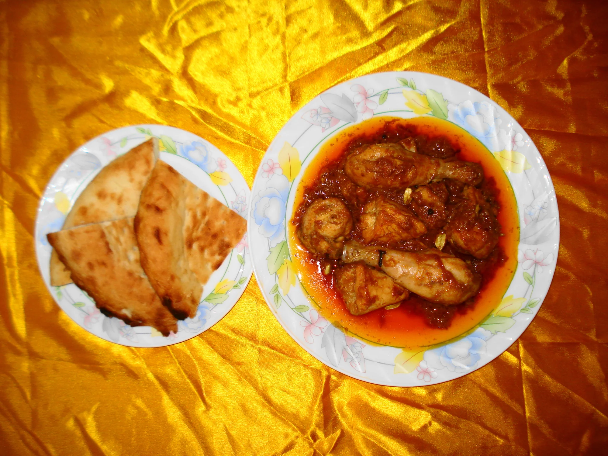 Chicken korma served with traditional taftan bread