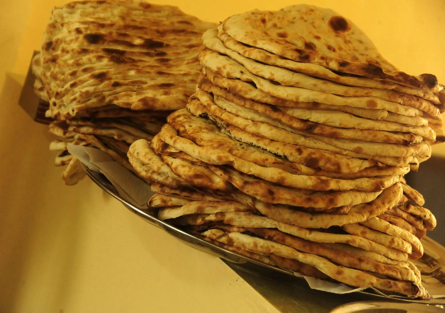 Traditional Afghan bread showing distinctive patterns and size