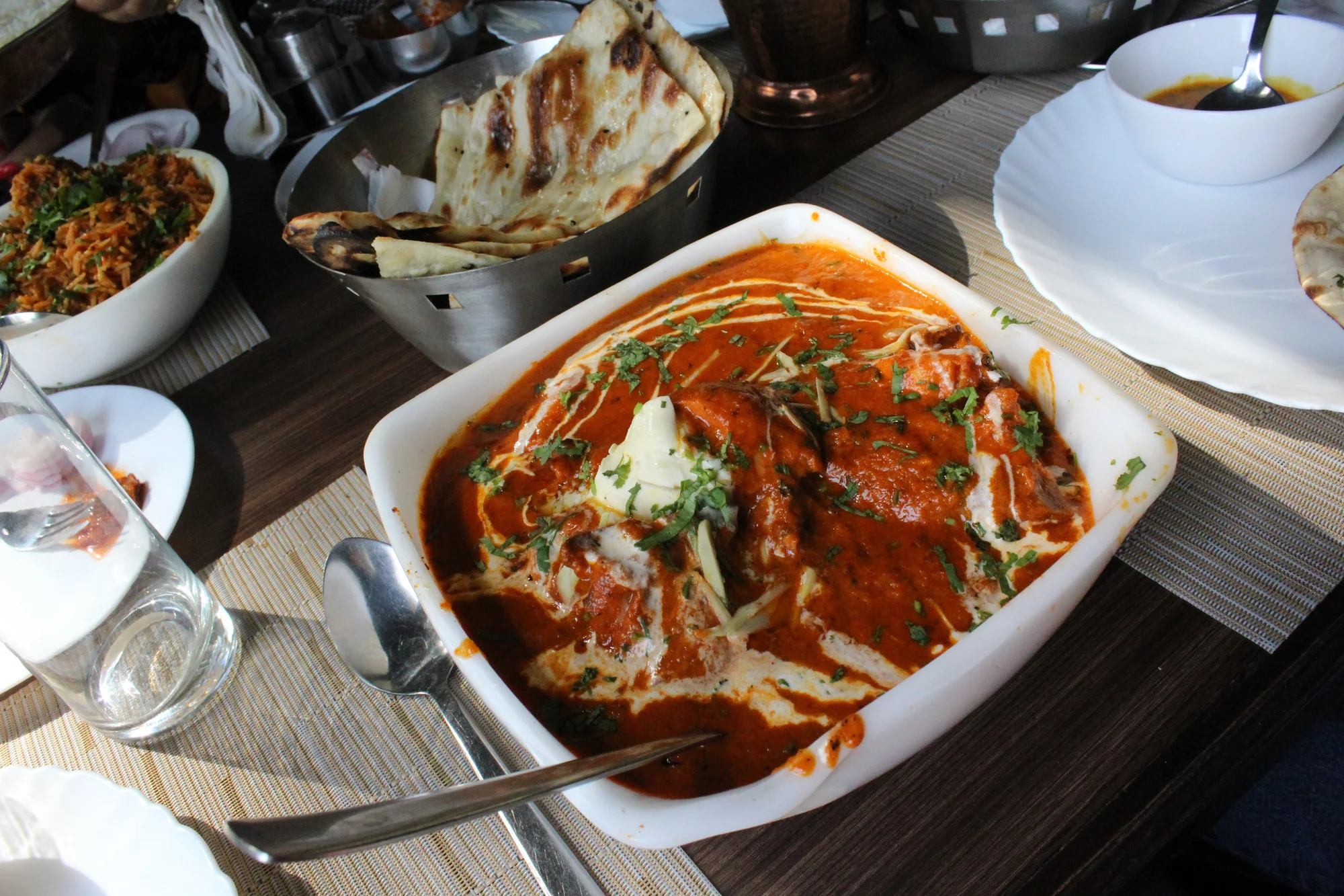 Close-up view of creamy butter chicken showing the rich texture of the gravy