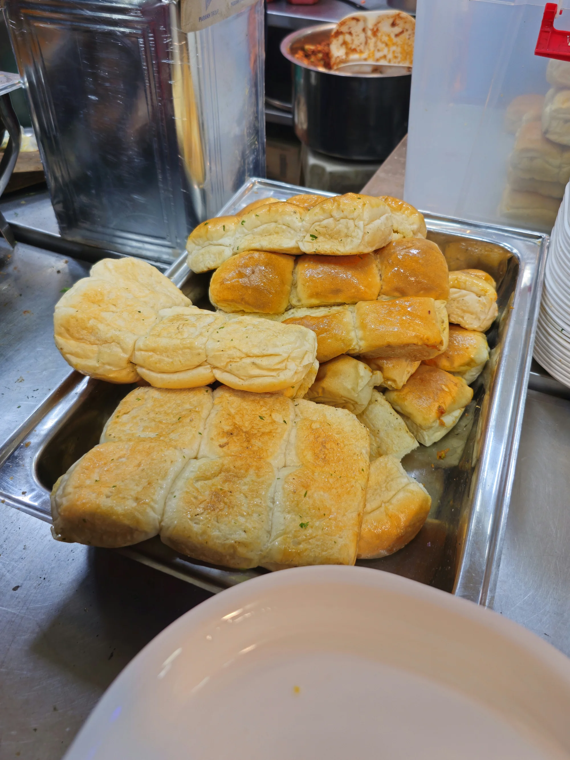 Soft white bread rolls (pav) arranged together