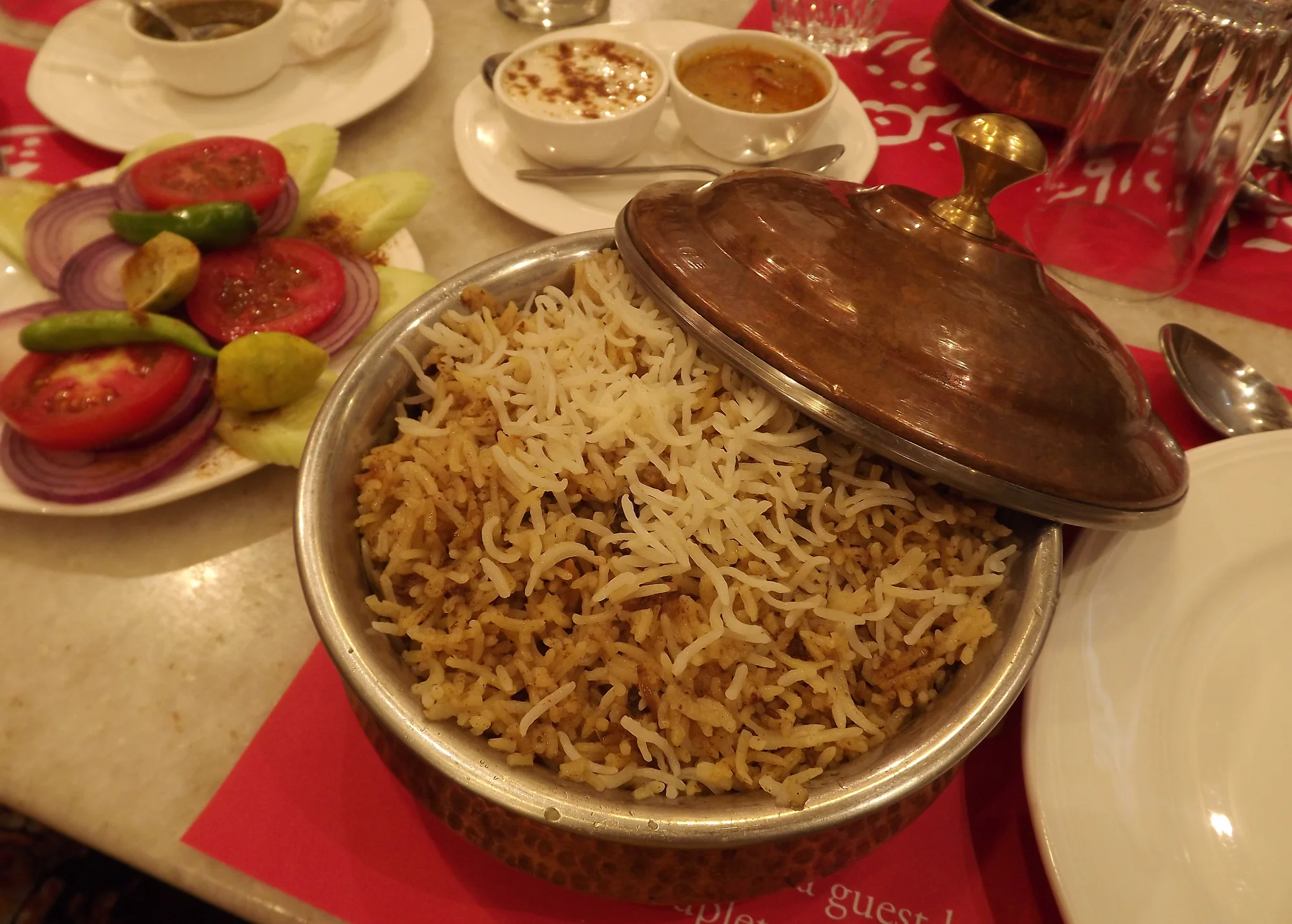 Complete Hyderabadi Biryani meal with accompaniments