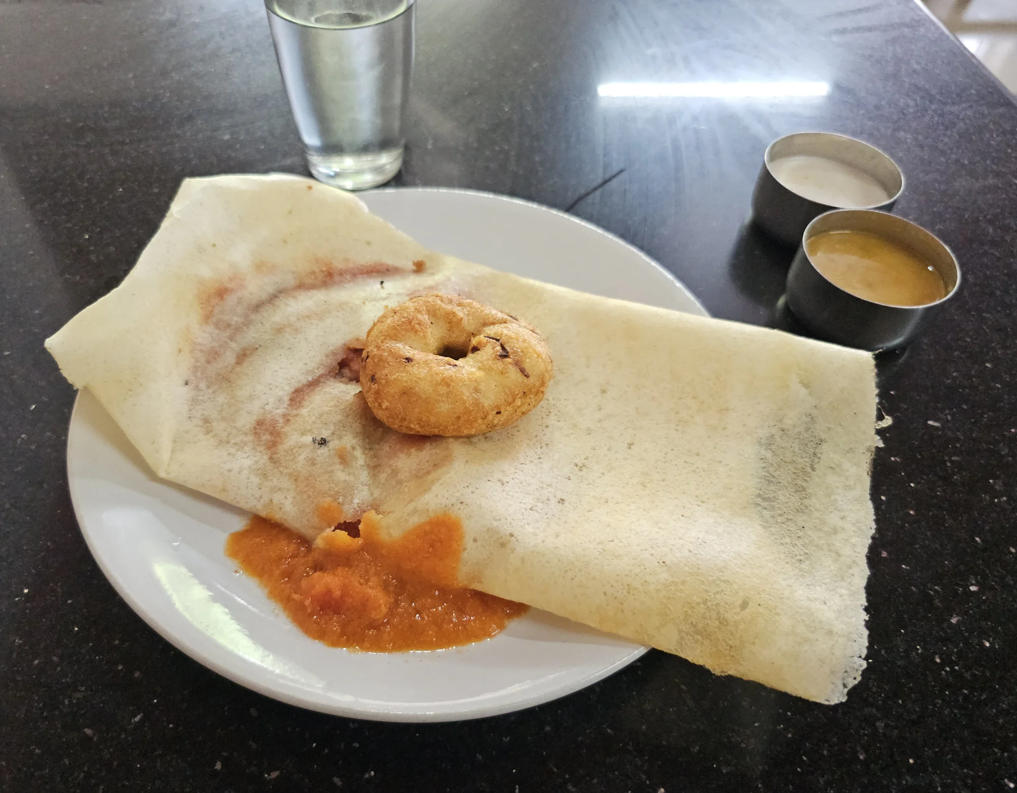 Masala dosa served with medu vada and accompaniments