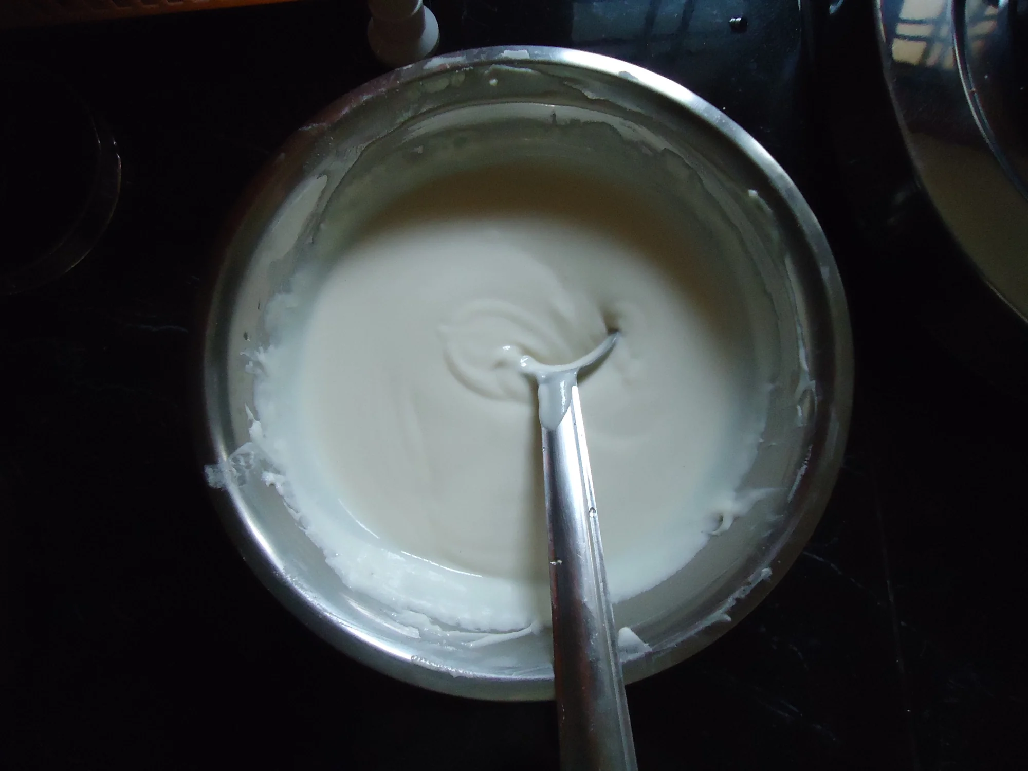 Fermented idli batter showing bubbles and airy texture