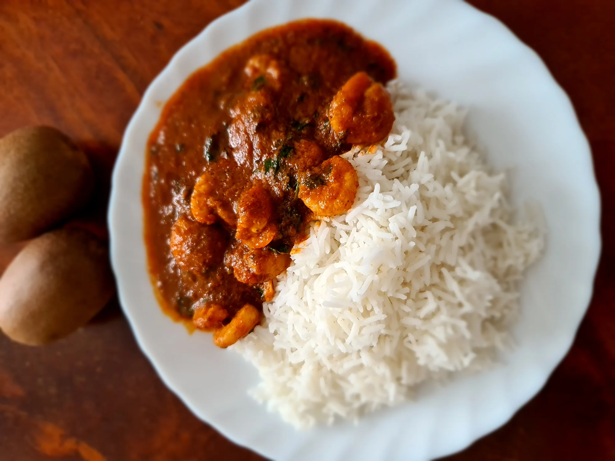 Prawn vindaloo showing seafood adaptation of the traditional recipe