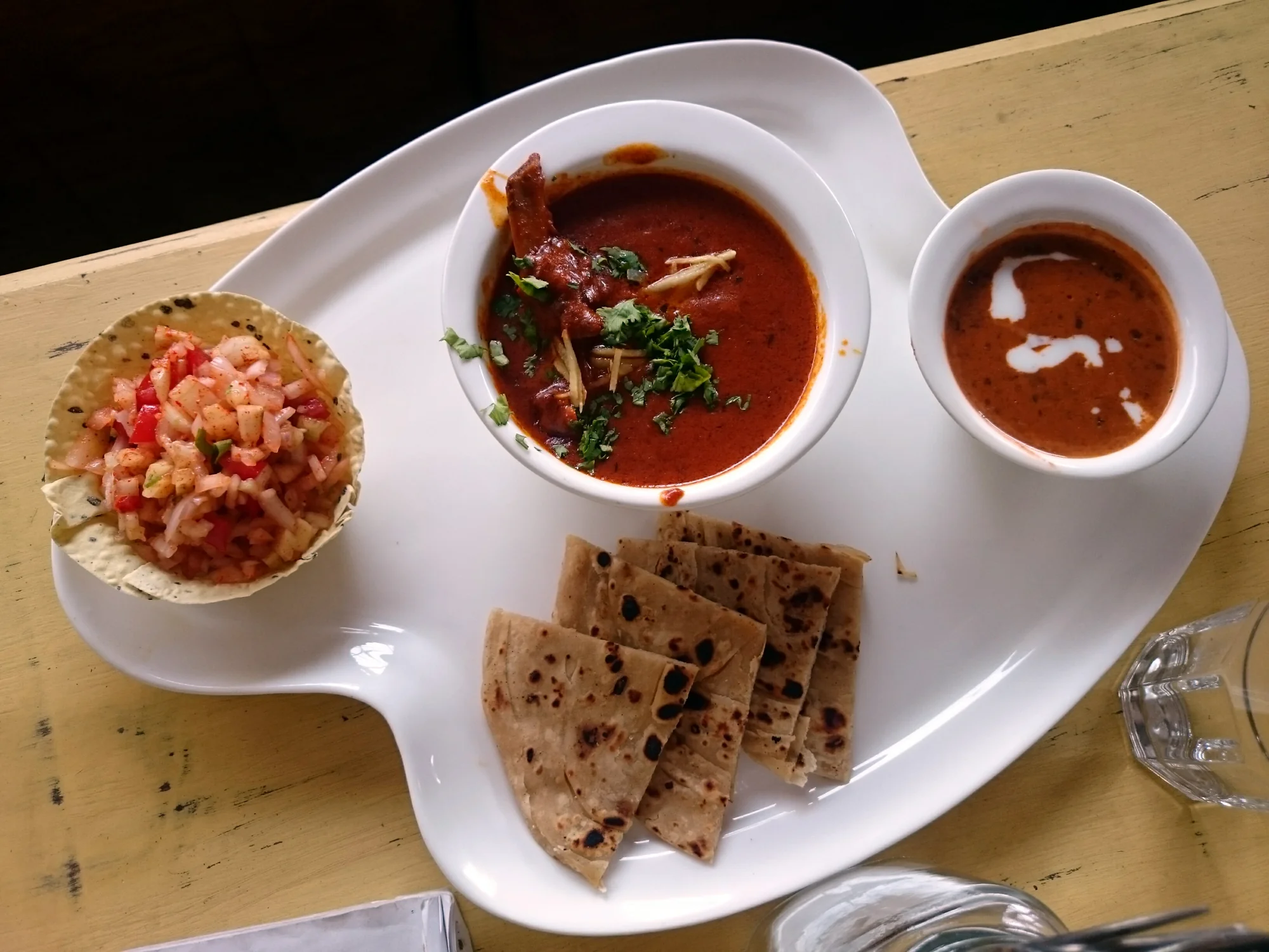 Rogan Josh served with dal makhani and lacha parantha