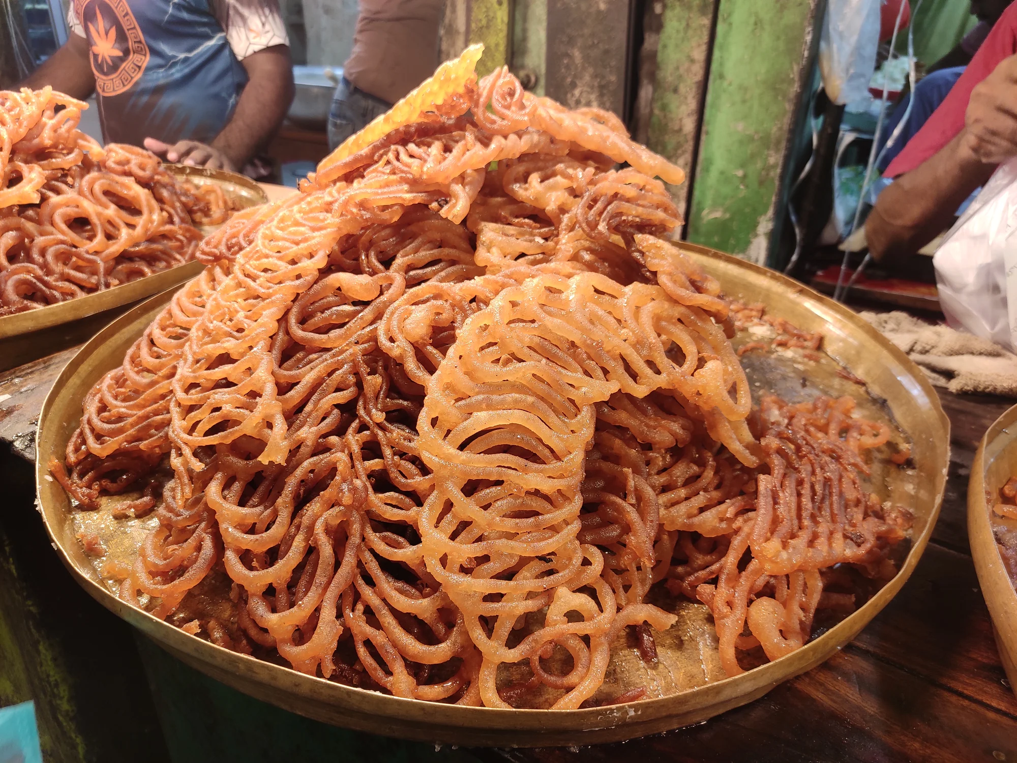 Close-up of freshly made jalebi showing texture and syrup coating