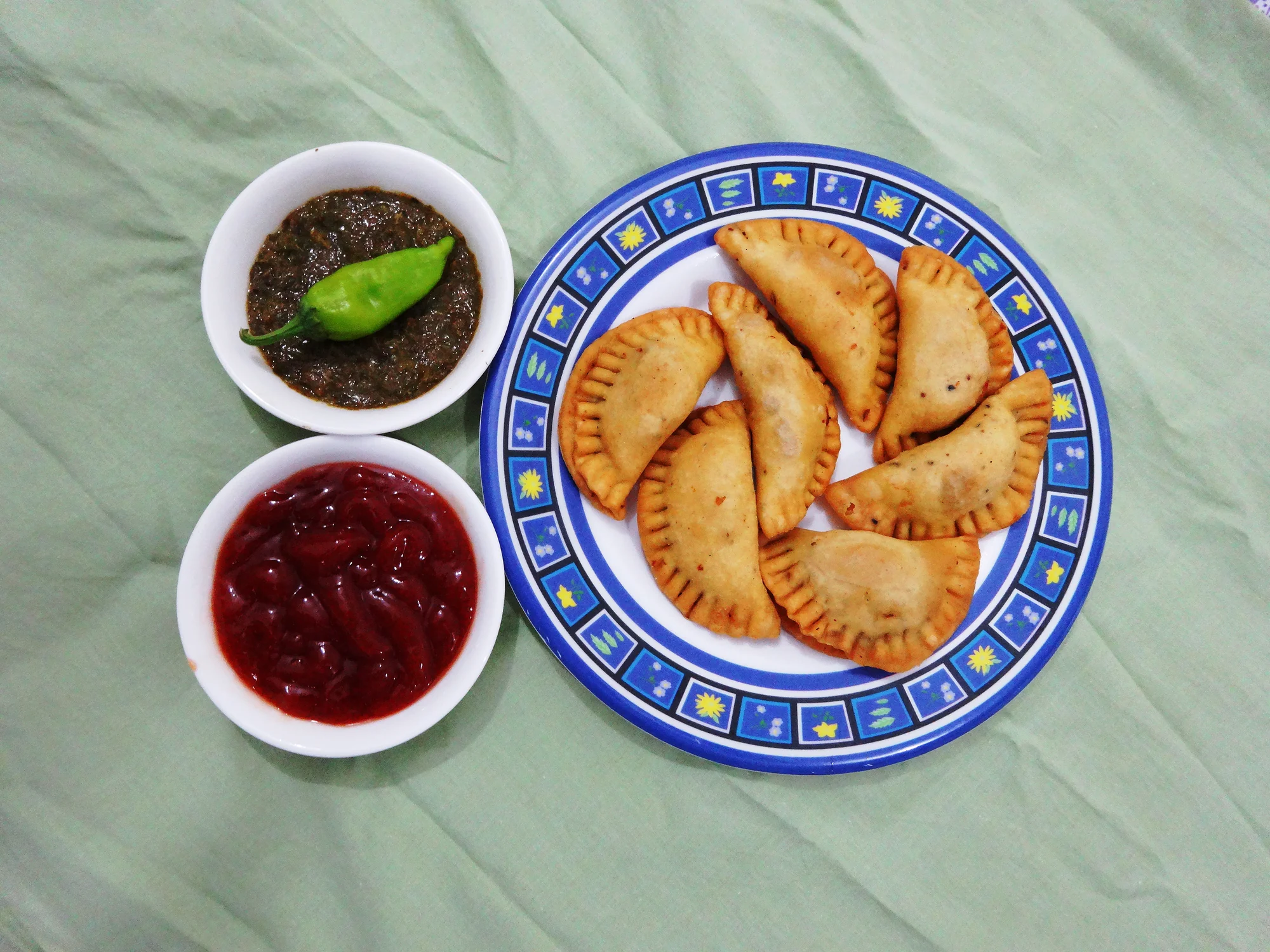 Middle Eastern sambousek on a decorative plate