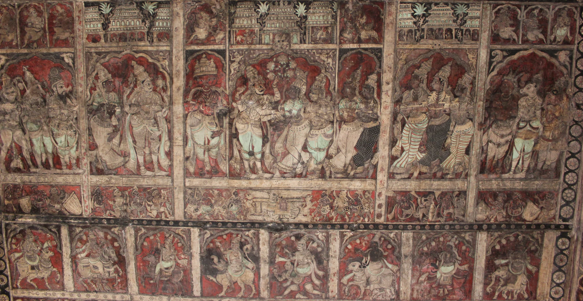 Elaborate ceiling paintings showing scenes from Hindu mythology at Virupaksha Temple