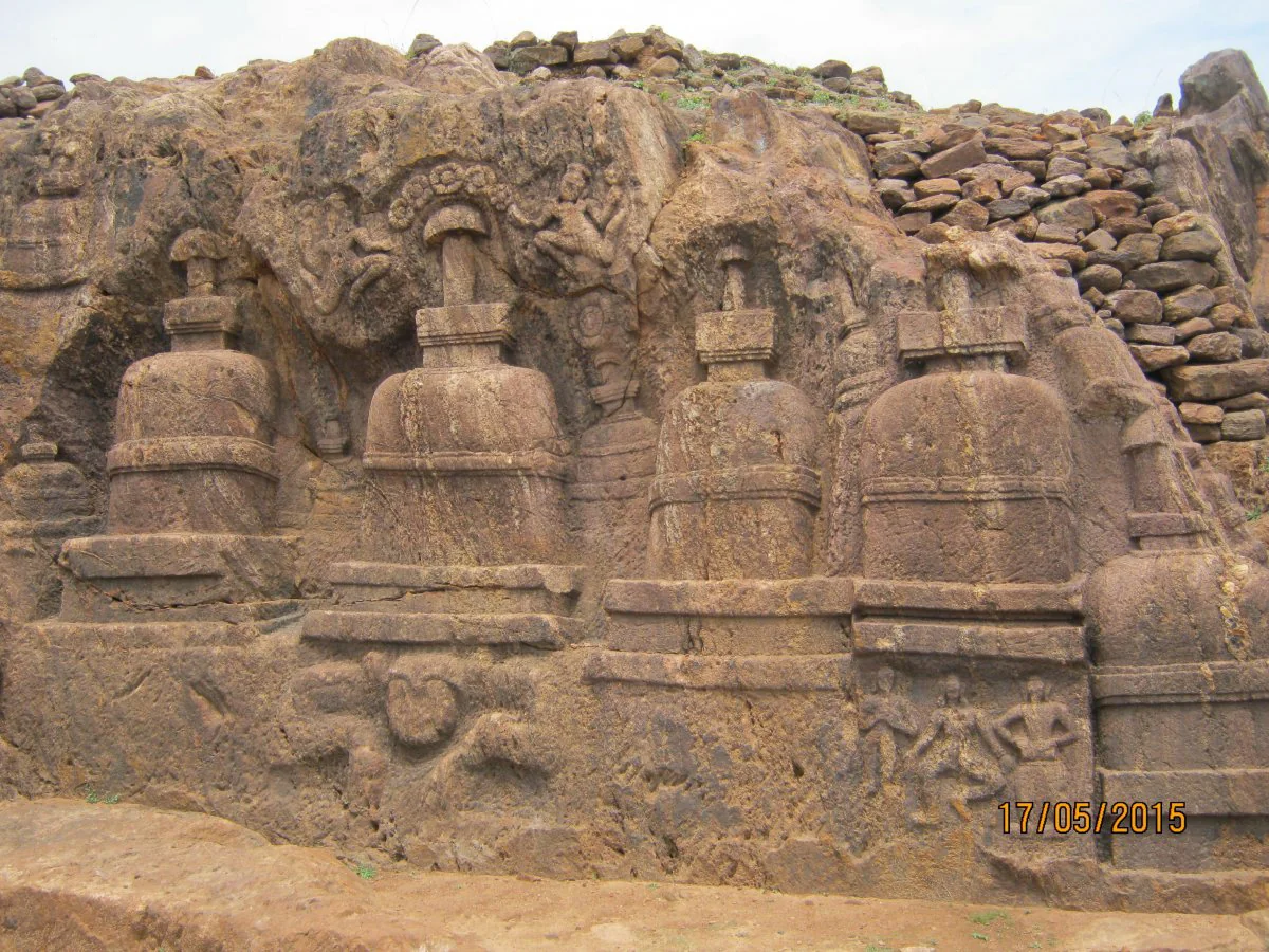 Multiple rock-cut stupas at the site