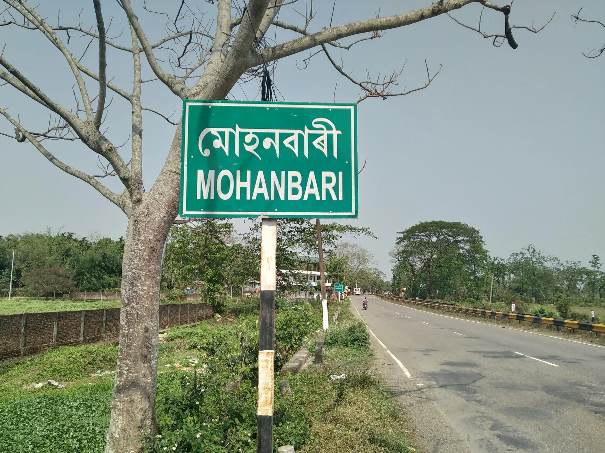 Road sign in Assamese language