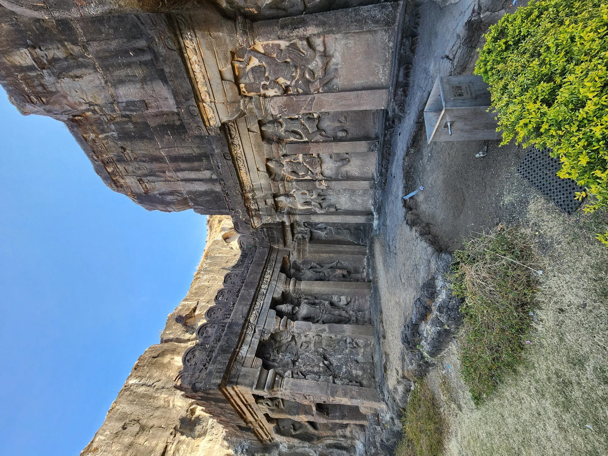 Panoramic view of Ellora Caves showing rock-cut architecture carved into basalt cliffs
