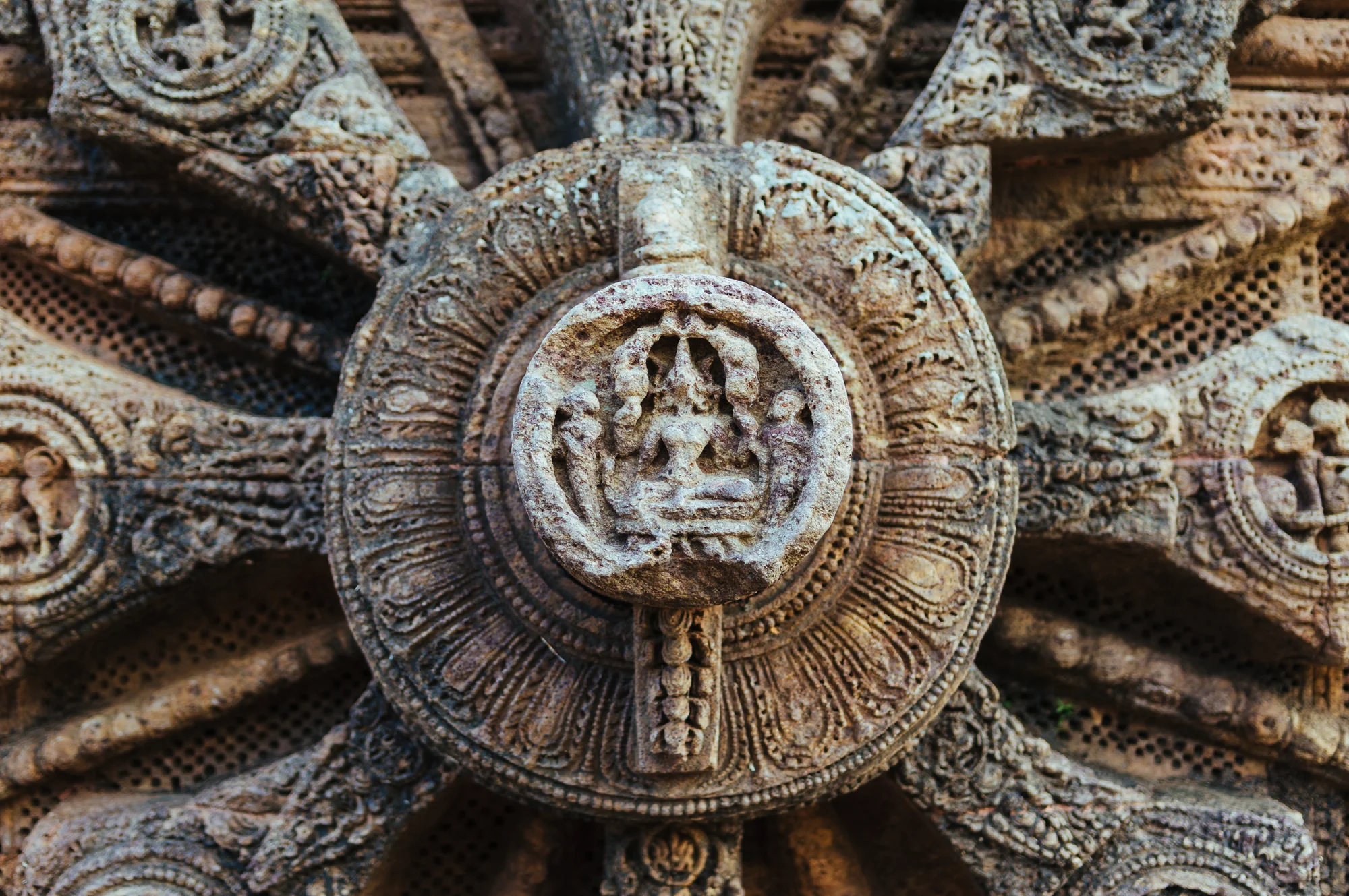 Close-up detail of wheel hub with intricate carvings