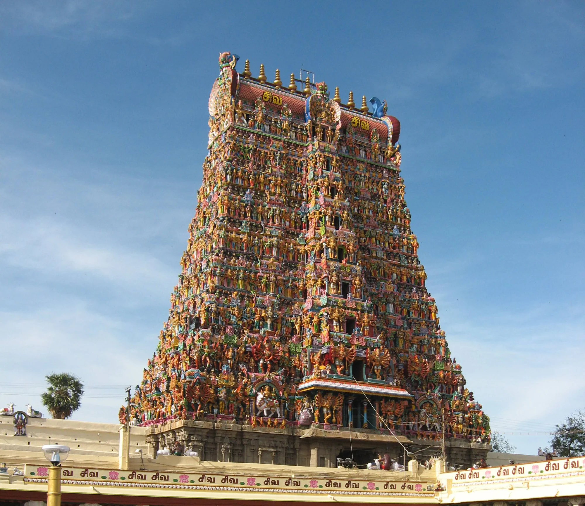 Towering gopuram of Meenakshi Temple covered with colorful sculptures