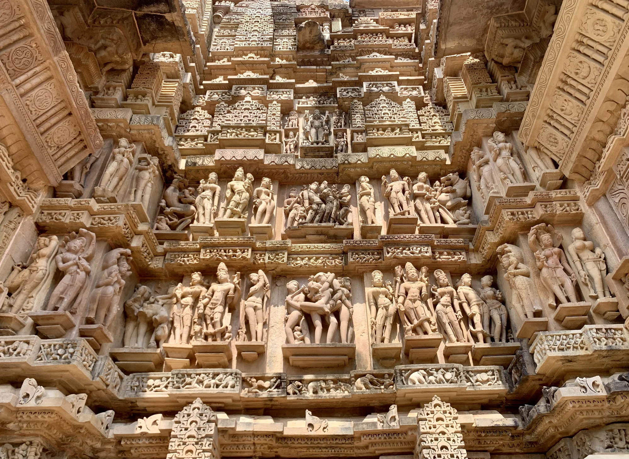 Exterior view of Khajuraho temple complex showing multiple shrines