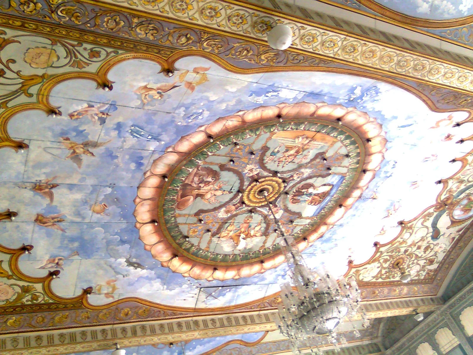 Intricate roof design with colorful patterns and glass work