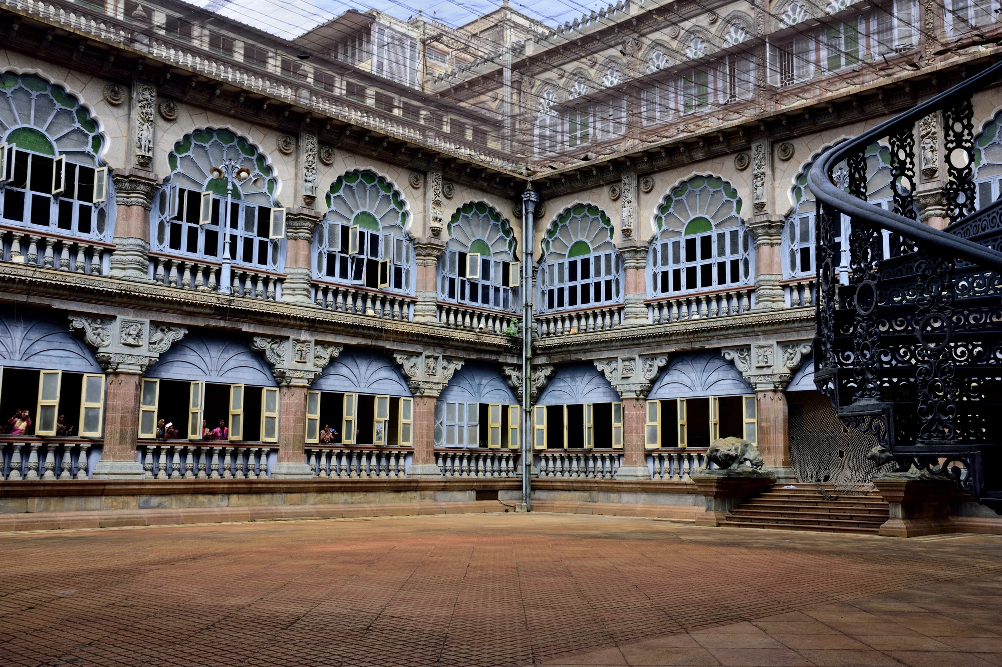 Courtyard of Mysore Palace with arched corridors