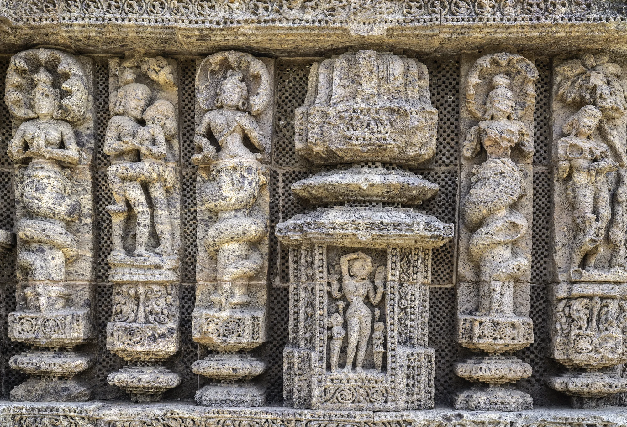 Detailed stone carvings on temple walls