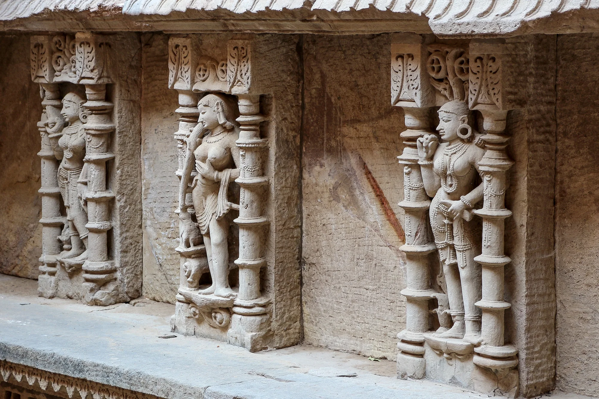 Carved pillars and architectural elements of the stepwell