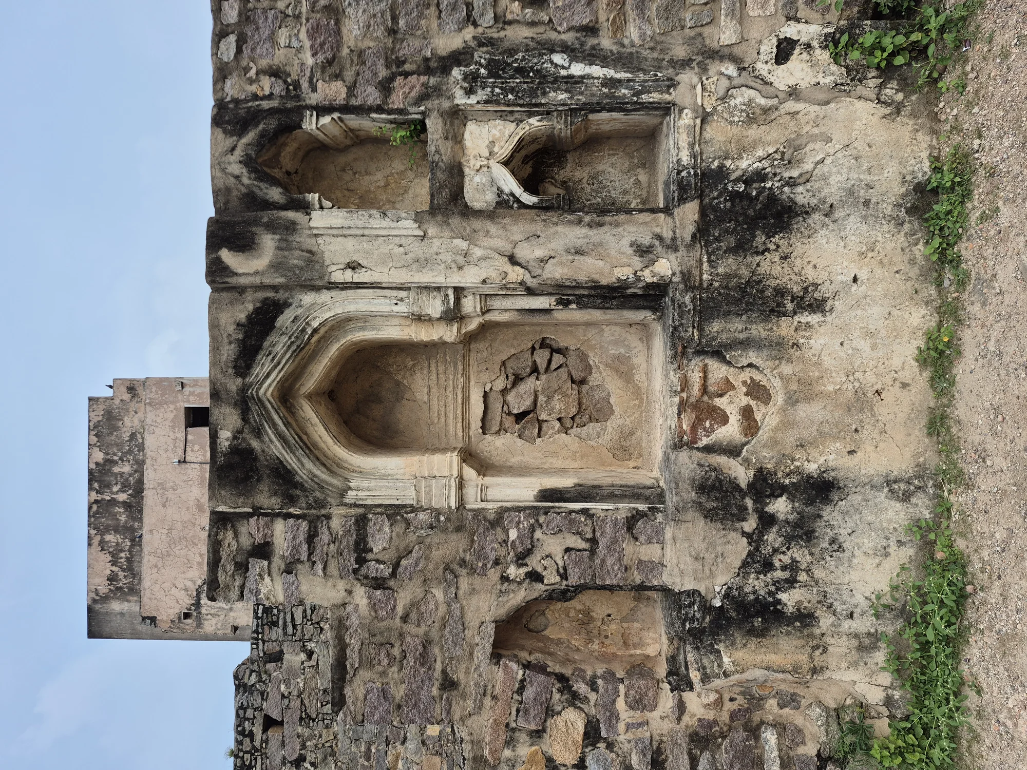 Panoramic view of Golconda Fort showing massive stone fortifications and bastions against clear sky