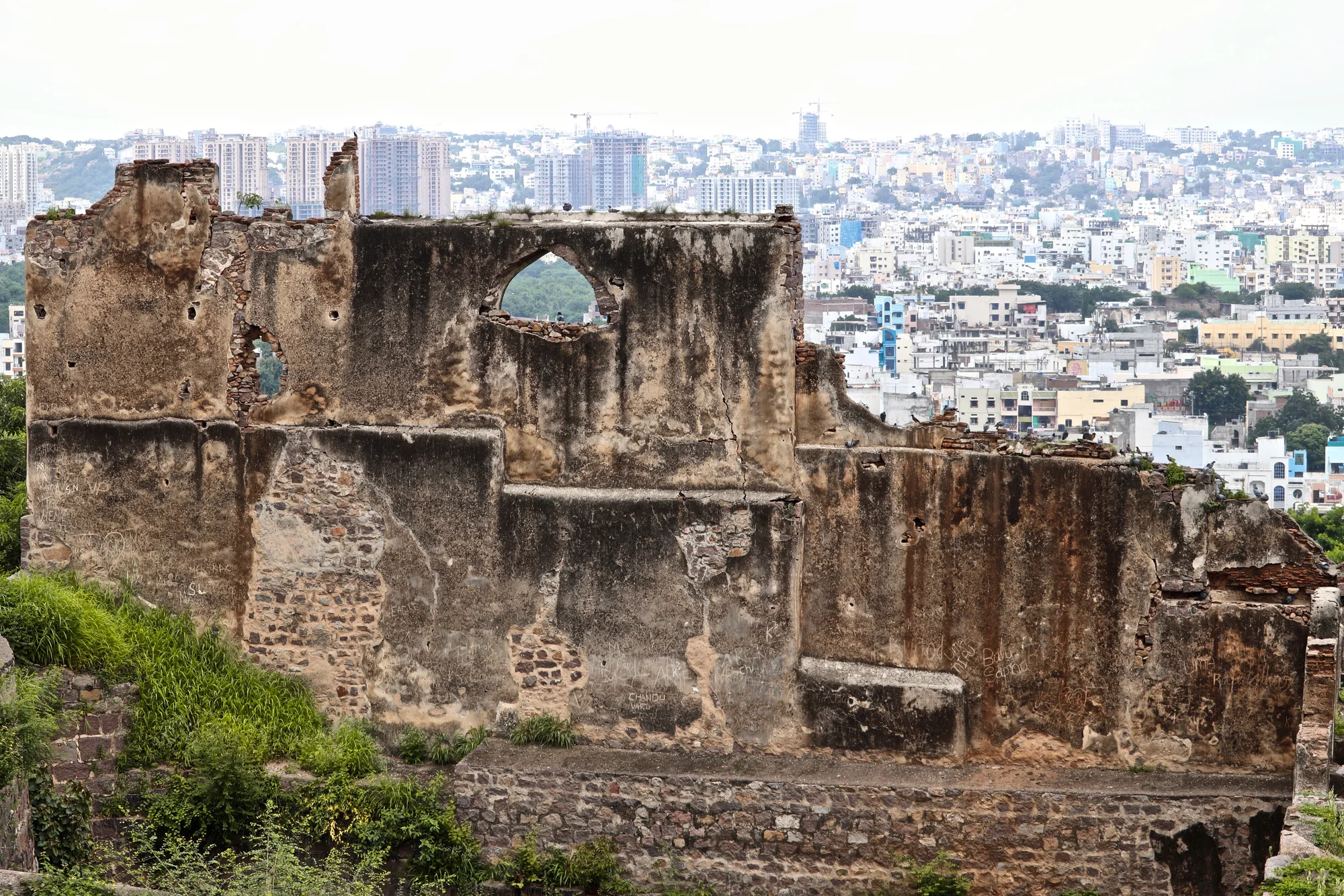Aerial view of Golconda Fort complex with modern Hyderabad city in background