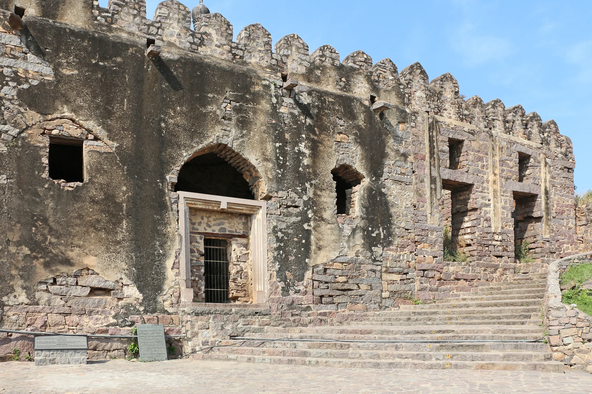 Ancient Ambar Khana structure showing deteriorated walls and arches