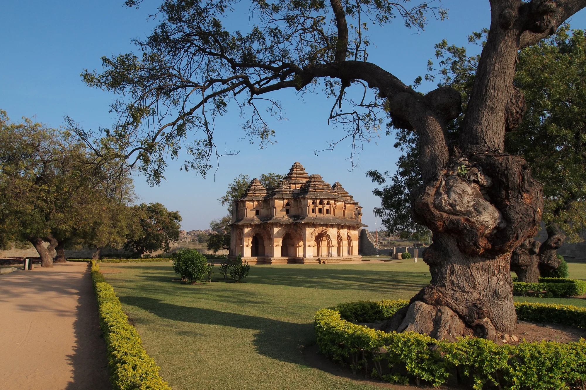 The Lotus Mahal at Hampi showing Indo-Islamic architectural fusion with symmetrical arches and multi-tiered pavilion structure