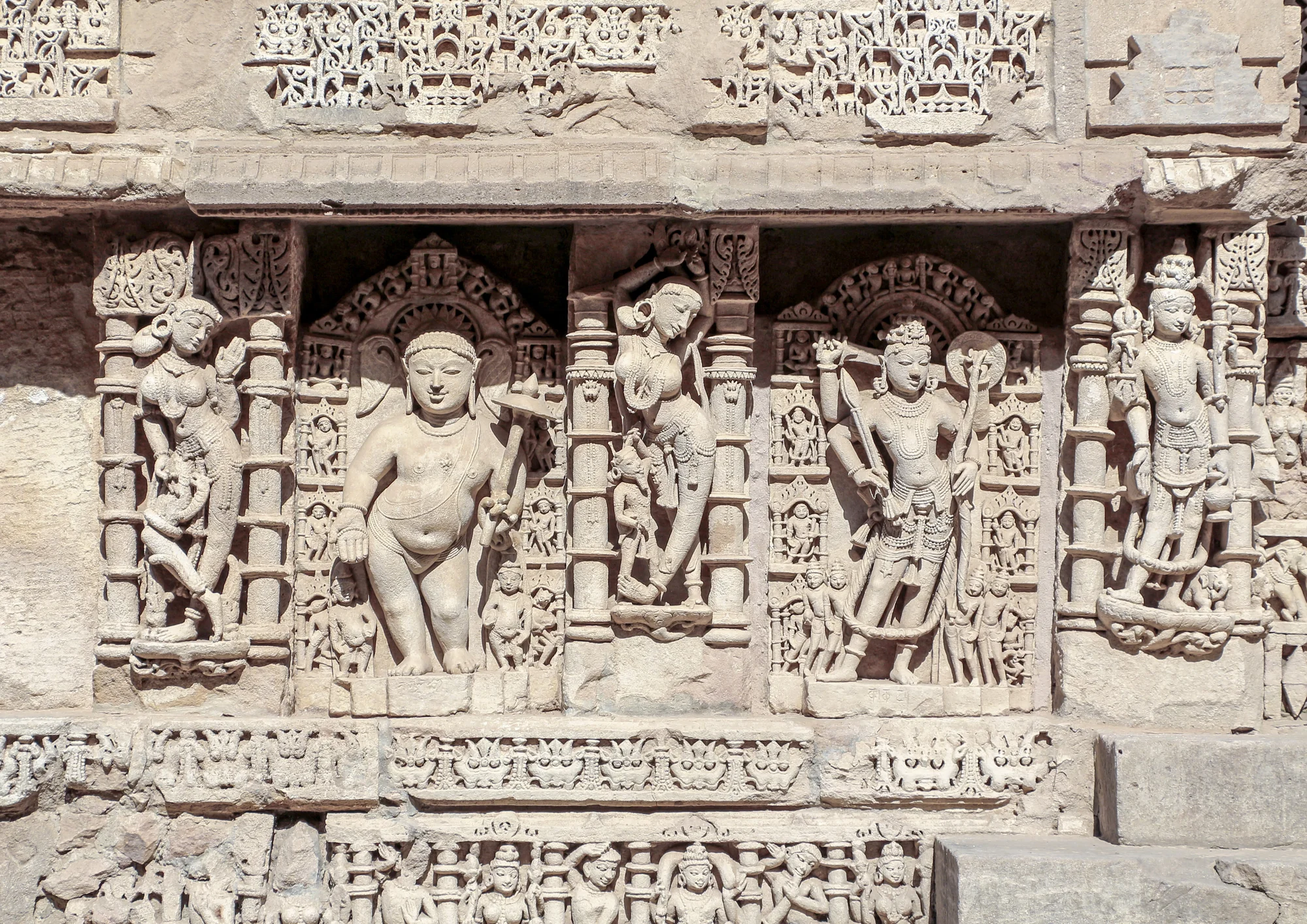 Detailed sculpture of a deity carved in sandstone