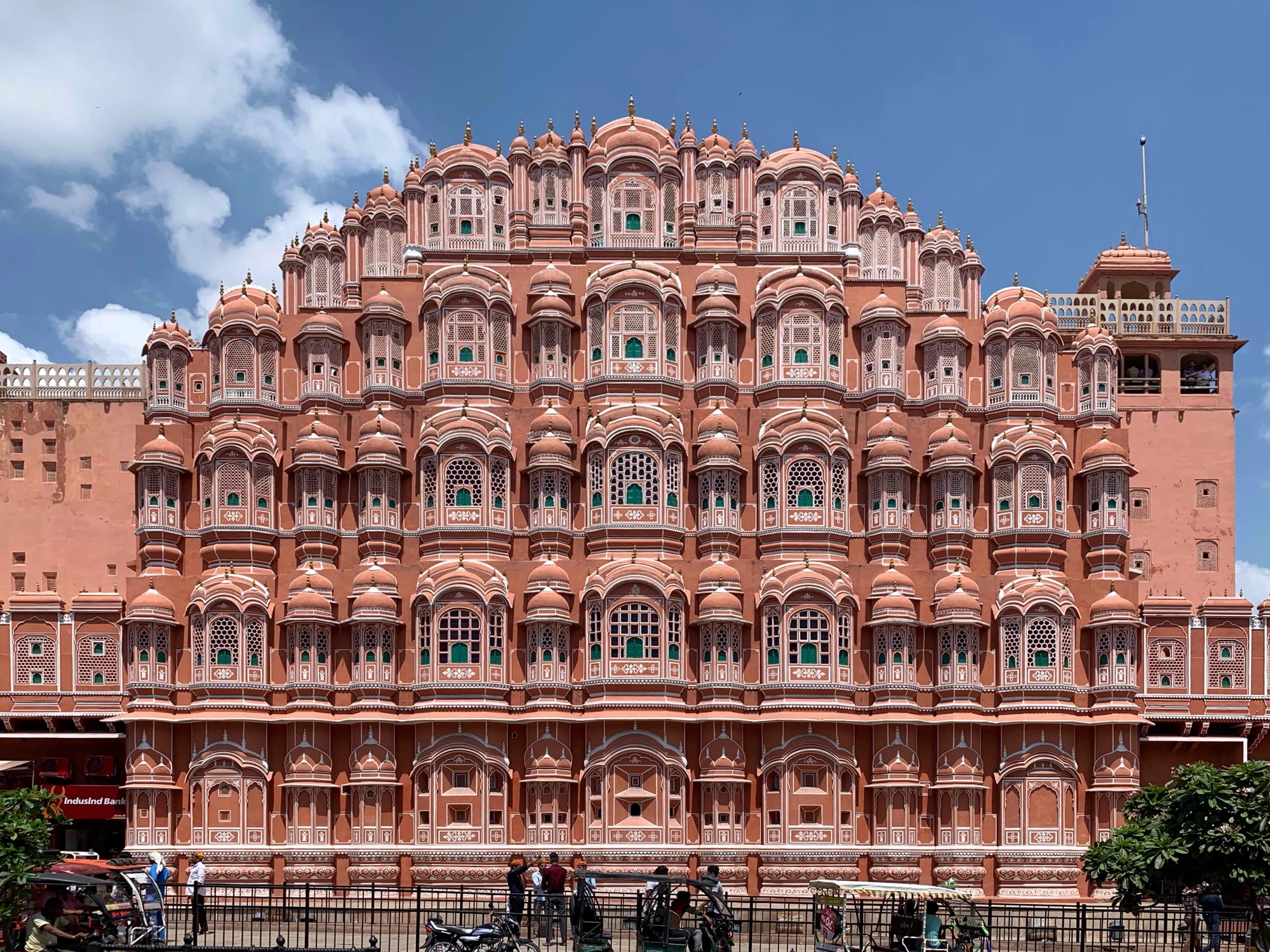 Ground-level view of Hawa Mahal's east façade showing the intricate pink sandstone architecture