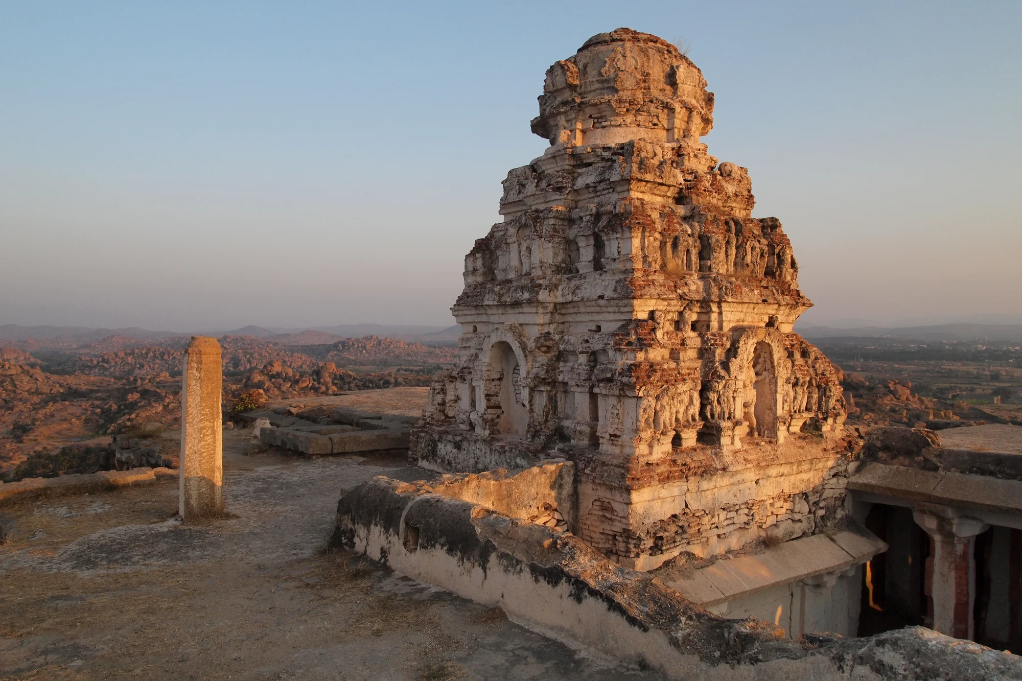 Ancient temple structure atop Matanga Hill surrounded by rocky terrain