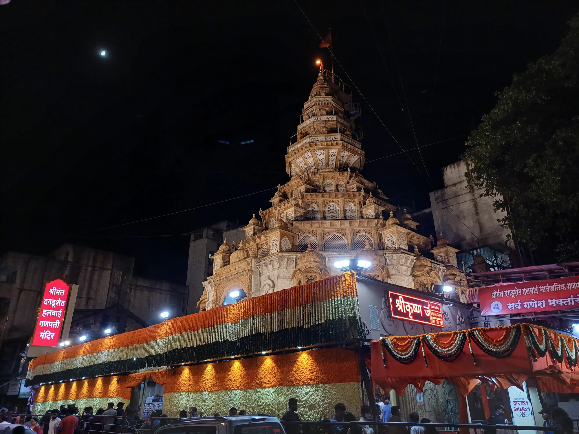 Dagadusheth Halwai Ganpati Temple illuminated at night